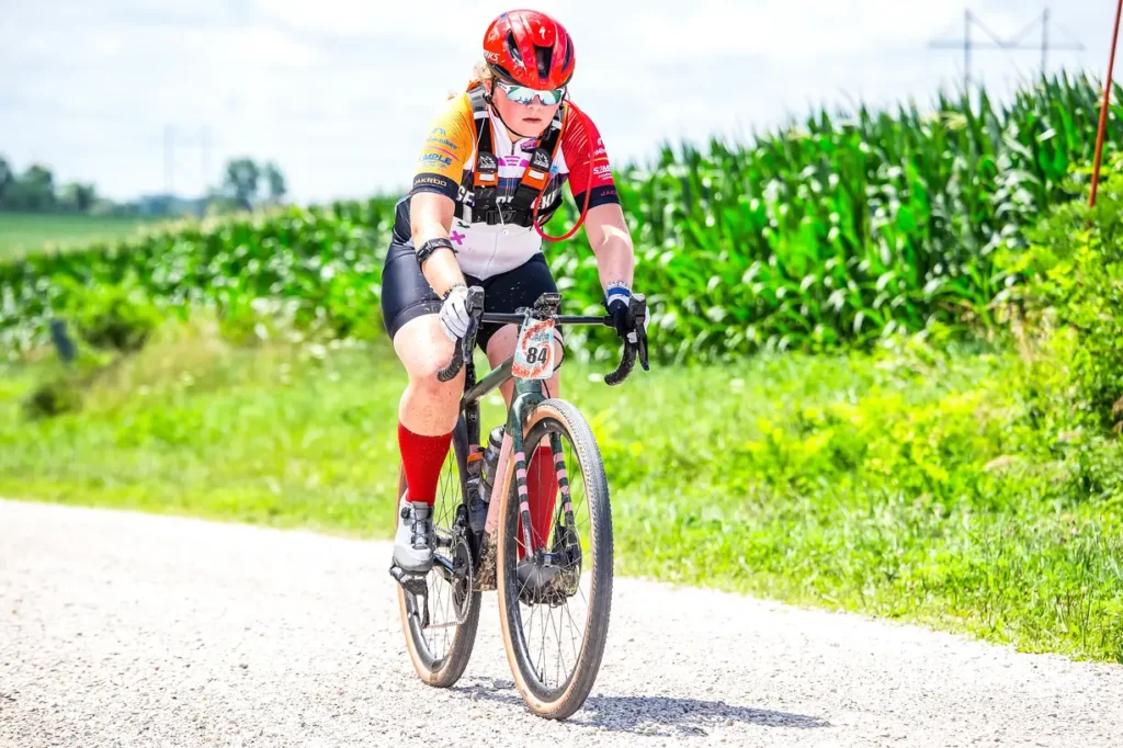Simple Endurance Coaching athlete racing gravel on a summer farm road